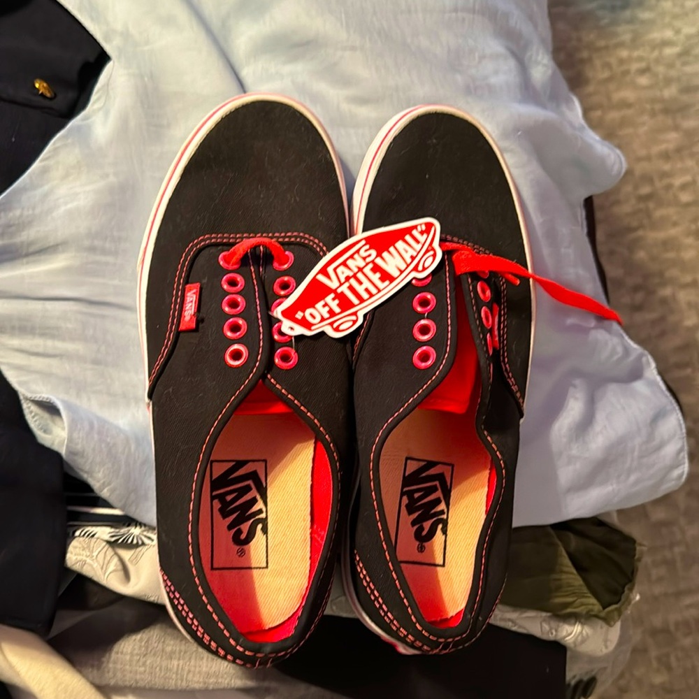 Brand new vans, black with orange trim, and laces!